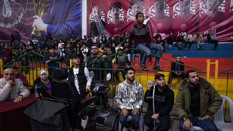 Palestinians watch a live broadcast of the World Cup third-place playoff soccer match between Morocco and Croatia played in Qatar, in Gaza City, Saturday, Dec. 17, 2022. (AP Photo/Fatima Shbair)
