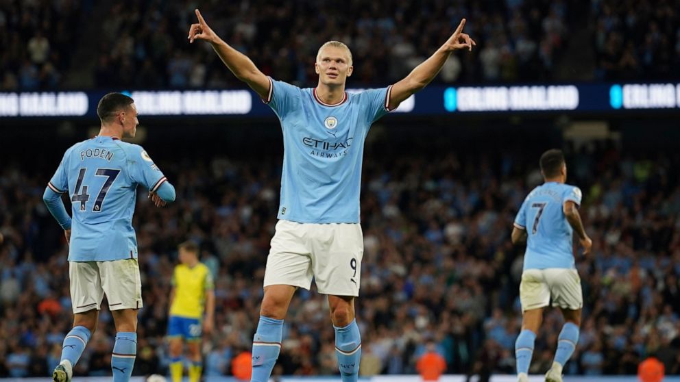 Manchester City's Erling Haaland, centre, celebrates after scoring his side's third goal during the English Premier League soccer match between Manchester City and Nottingham Forest at Etihad Stadium in Manchester, England, Wednesday, Aug 31, 2022. (