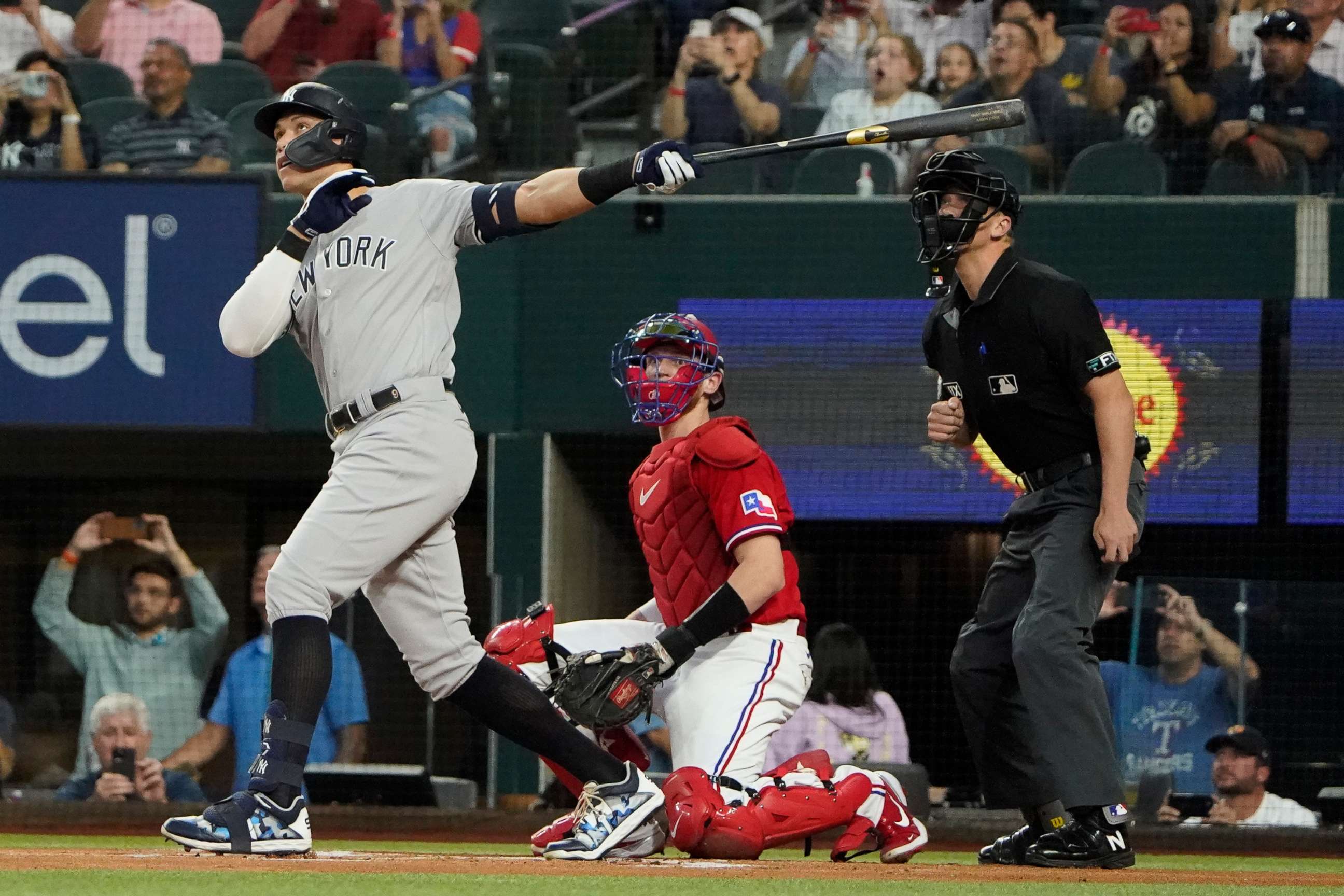 PHOTO: New York Yankees' Aaron Judge hits a solo home, his 62nd of the season, in Arlington, Texas, Oct. 4, 2022.