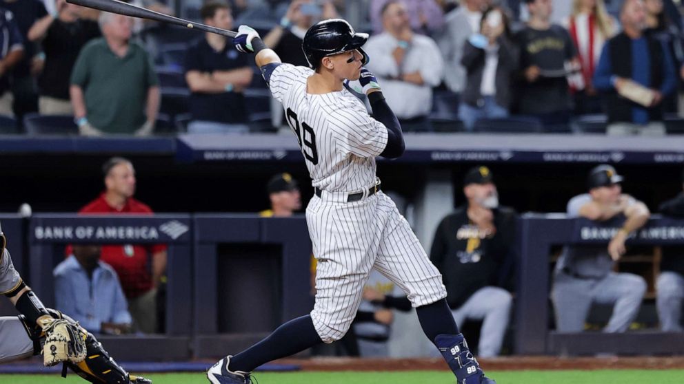 PHOTO: New York Yankees' Aaron Judge follows through on his 60th home run of the season, during the ninth inning of the team's baseball game against the Pittsburgh Pirates on Tuesday, Sept. 20, 2022, in New York.