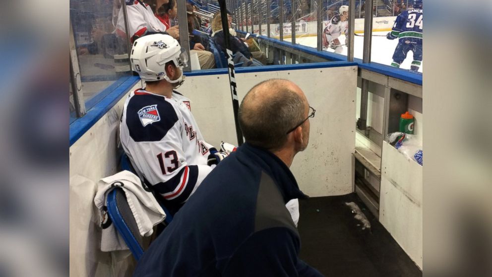 Kevin Girouard sits with a Hartford Wolf Pack player serving time in the penalty box during a game at the XL Center in Hartford, Conn. on Oct. 29, 2016 