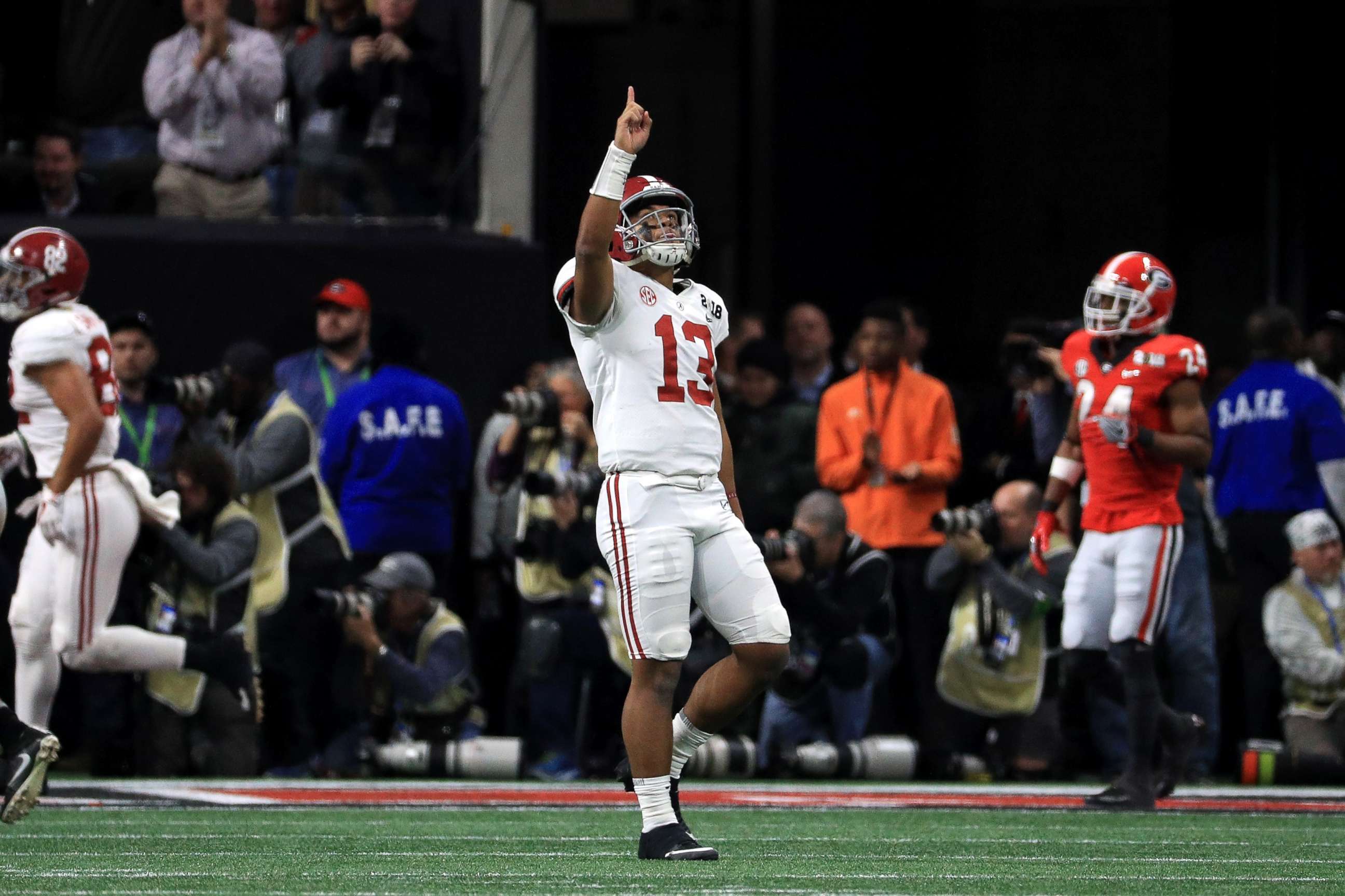PHOTO: Tua Tagovailoa of the Alabama Crimson Tide celebrates a six yard touchdown pass during the third quarter against the Georgia Bulldogs in the CFP National Championship presented, Jan. 8, 2018, in Atlanta.