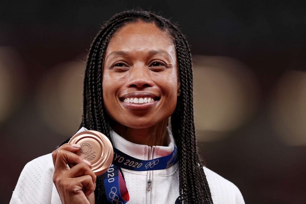 PHOTO: Bronze medalist Allyson Felix of Team USA holds her medal on the podium during the medal ceremony for the women's 400-meter on day 14 of the Tokyo 2020 Olympic Games at Olympic Stadium on Aug. 6, 2021, in Tokyo.