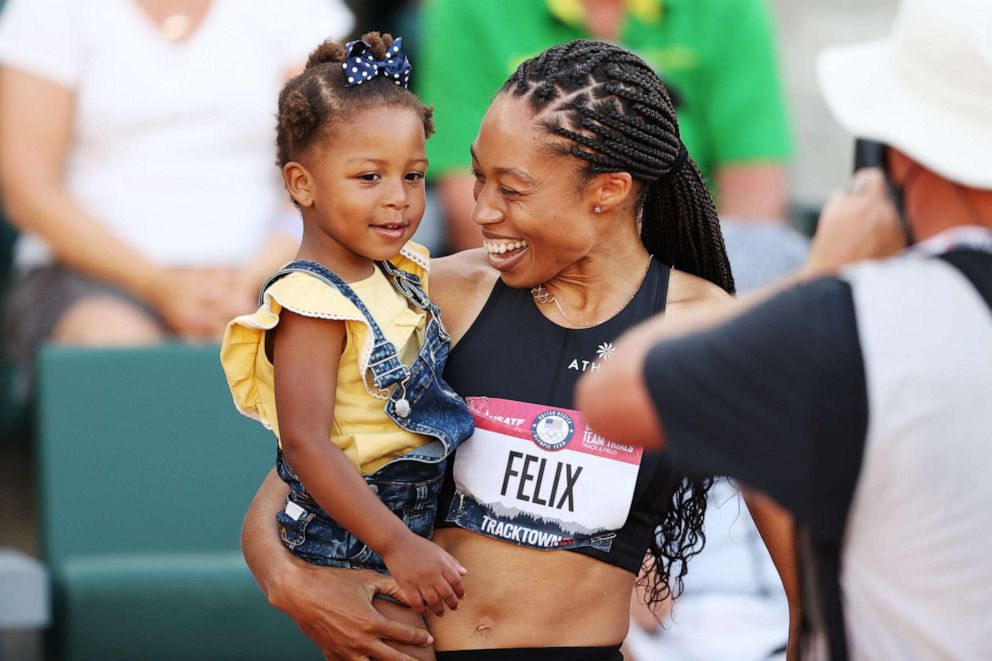 PHOTO: Allyson Felix celebrates with her daughter Camryn after finishing second in the women's 400-meter final at the 2020 U.S. Olympic track and field trials on June 20, 2021 in Eugene, Ore.