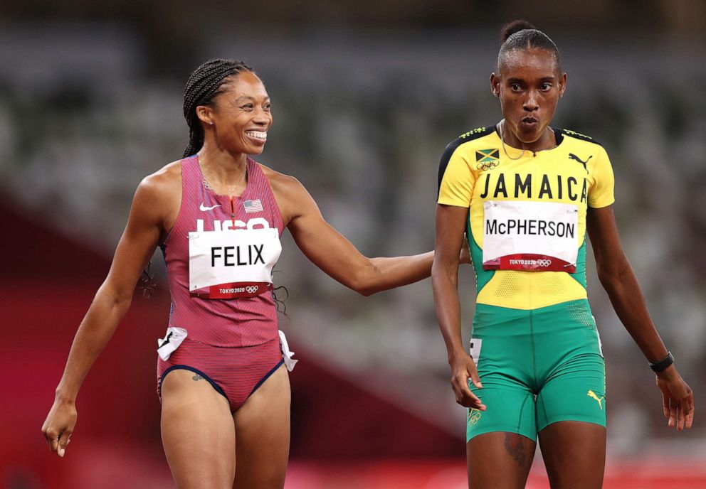 PHOTO: Allyson Felix of the United States and Stephenie Ann McPherson of Jamaica interact after competing in the women's 400-meter semifinal on day 12 of the Tokyo 2020 Olympic Games at Olympic Stadium on Aug. 4, 2021, in Tokyo.