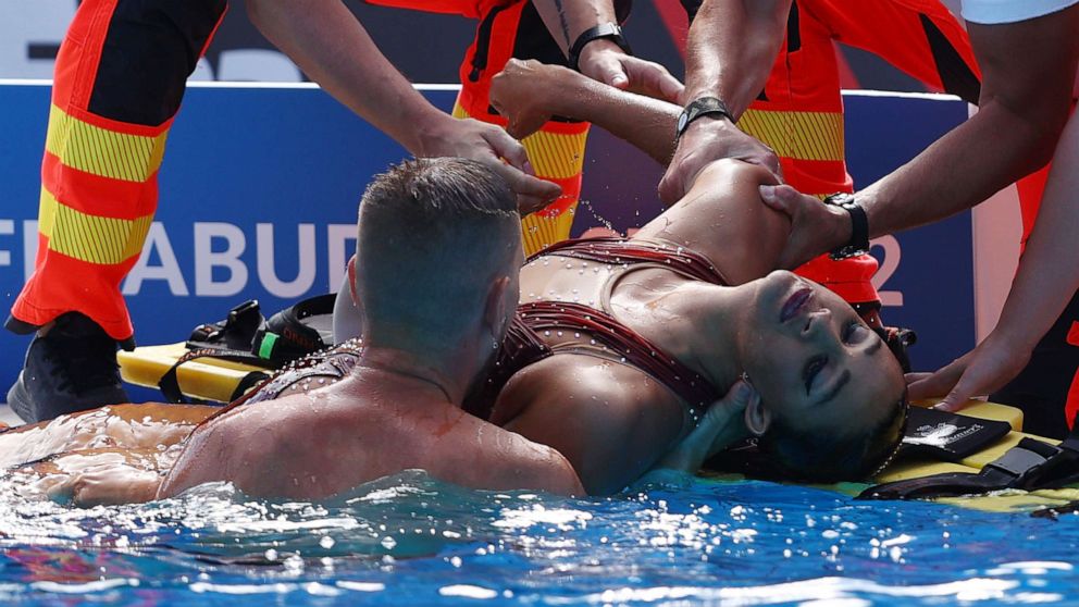 PICTURED: Anita Alvarez of Team USA is cared for by medical staff after her performance in the women's solo freestyle final on day six of the FINA World Championships Budapest 2022 on June 22, 2022 in Budapest, in Hungary.