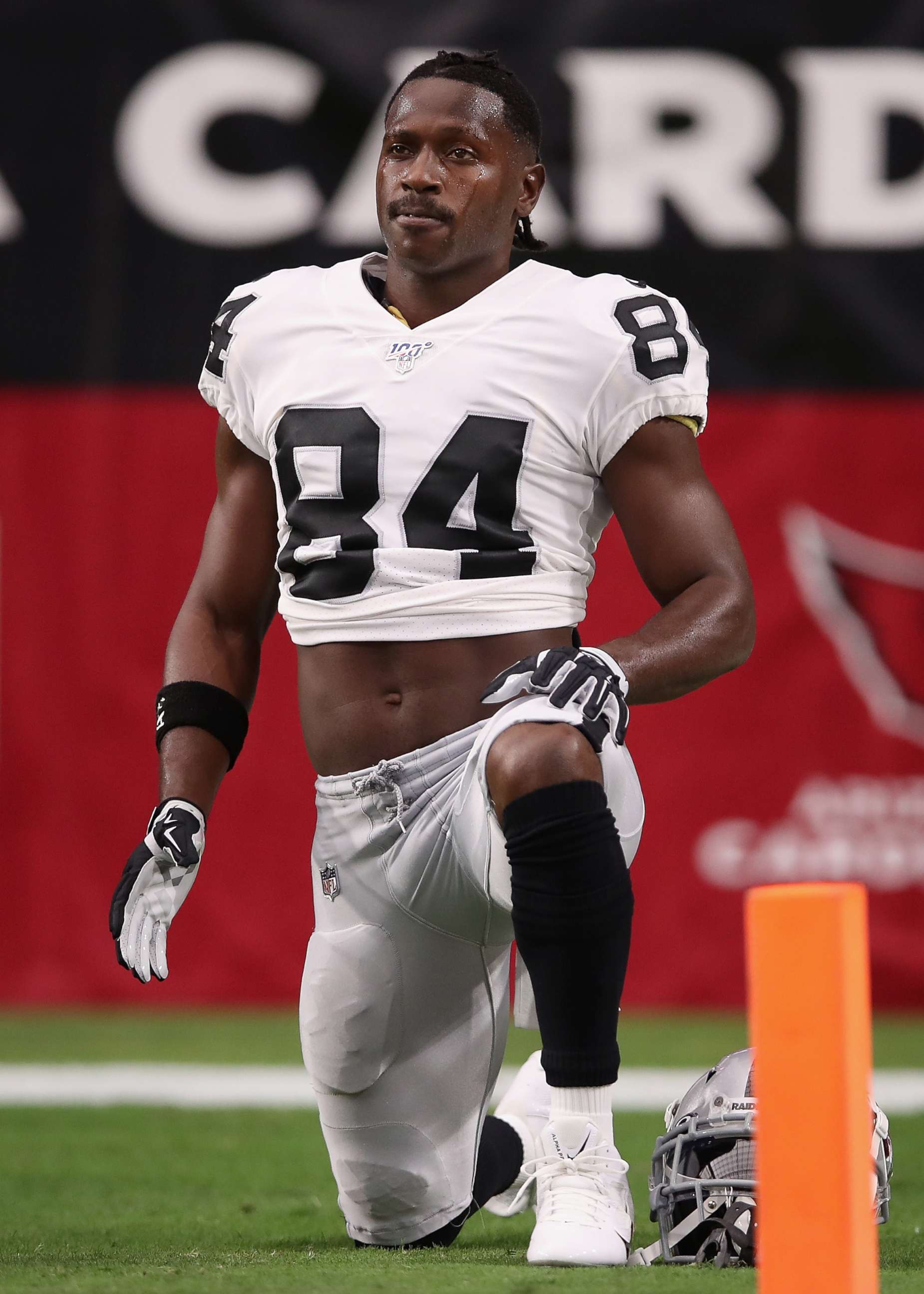 PHOTO: Wide receiver Antonio Brown of the Oakland Raiders warms up before the NFL preseason game against the Arizona Cardinals at State Farm Stadium on Aug. 15, 2019 in Glendale, Ariz.