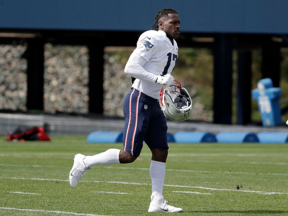 PHOTO: Antonio Brown carries his helmet during a practice on Wednesday, Sept. 18. He was released by New England on Friday.