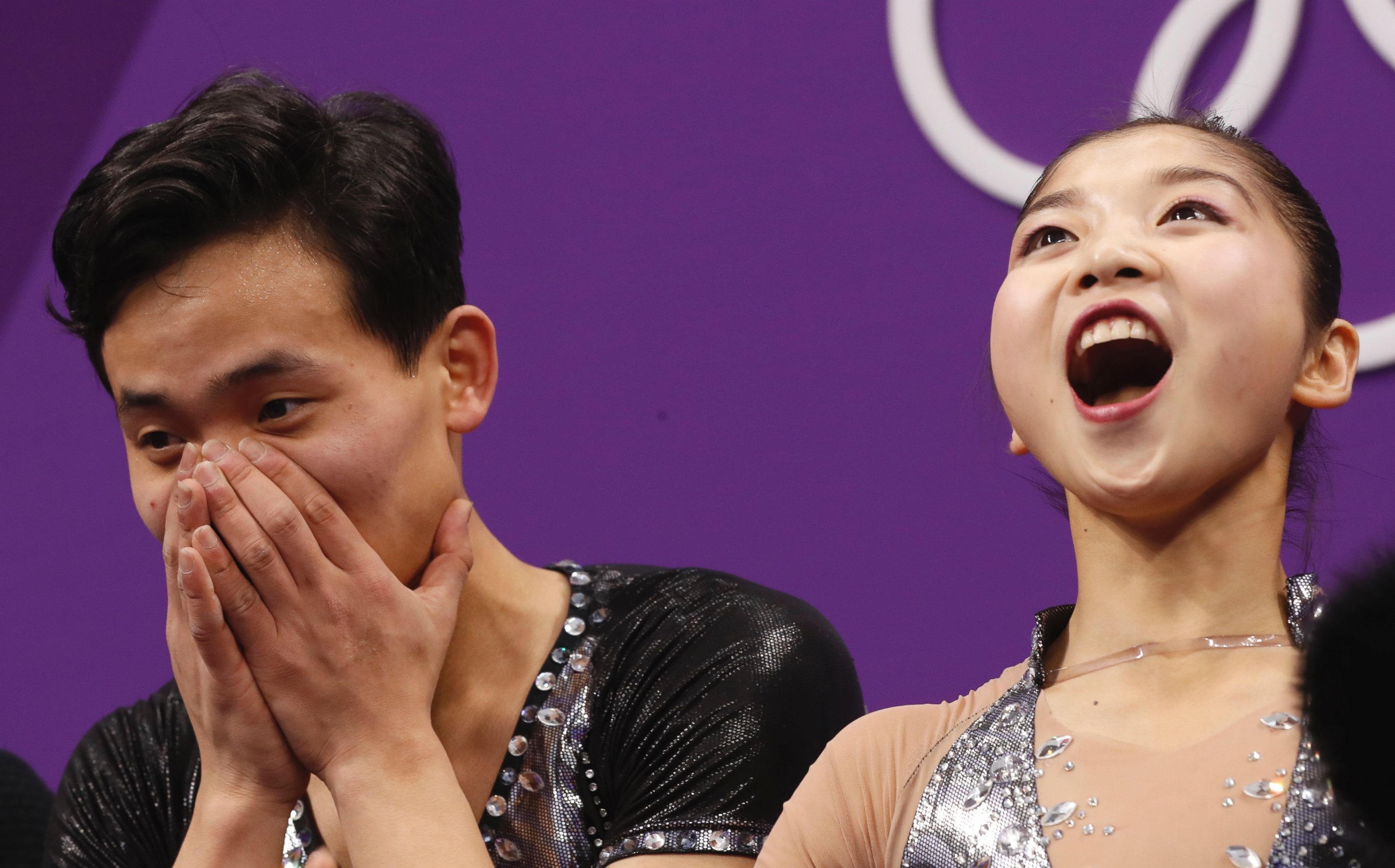 Ryom Tae Ok and Kim Ju Sik of North Korea react after their scores are posted following their performance in the pair figure skating short program in the Gangneung Ice Arena at the 2018 Winter Olympics in Gangneung, South Korea, Wednesday, Feb. 14, 2018.