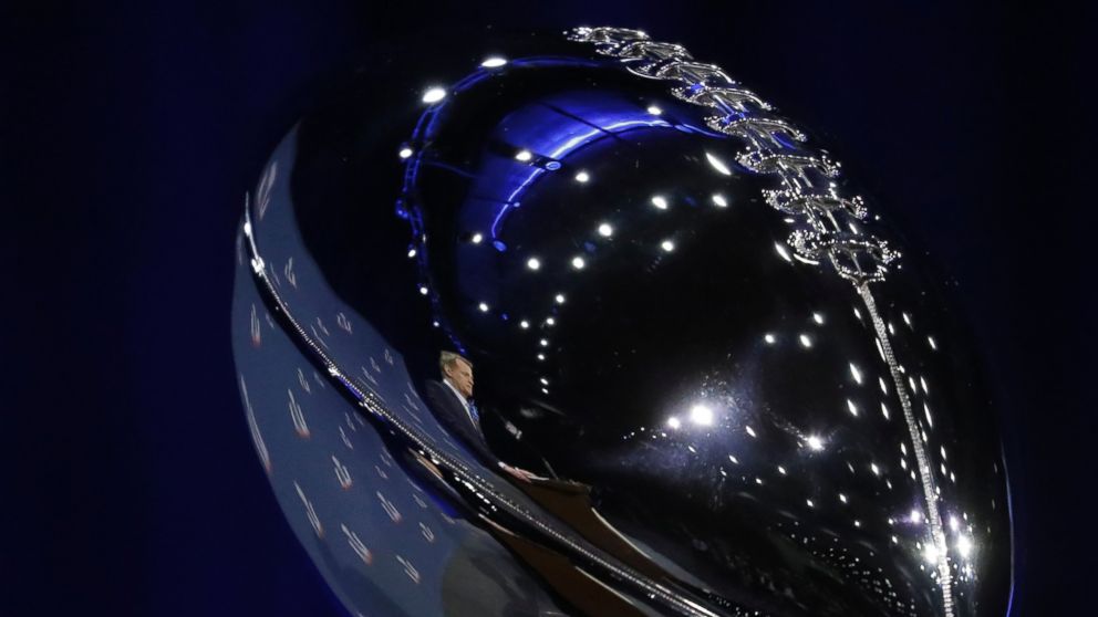 PHOTO: NFL Commissioner Roger Goodell is reflected in the Vince Lombardi Trophy as he answers questions during a news conference during preparations for the NFL Super Bowl 51 football game, Feb. 1, 2017, in Houston. 