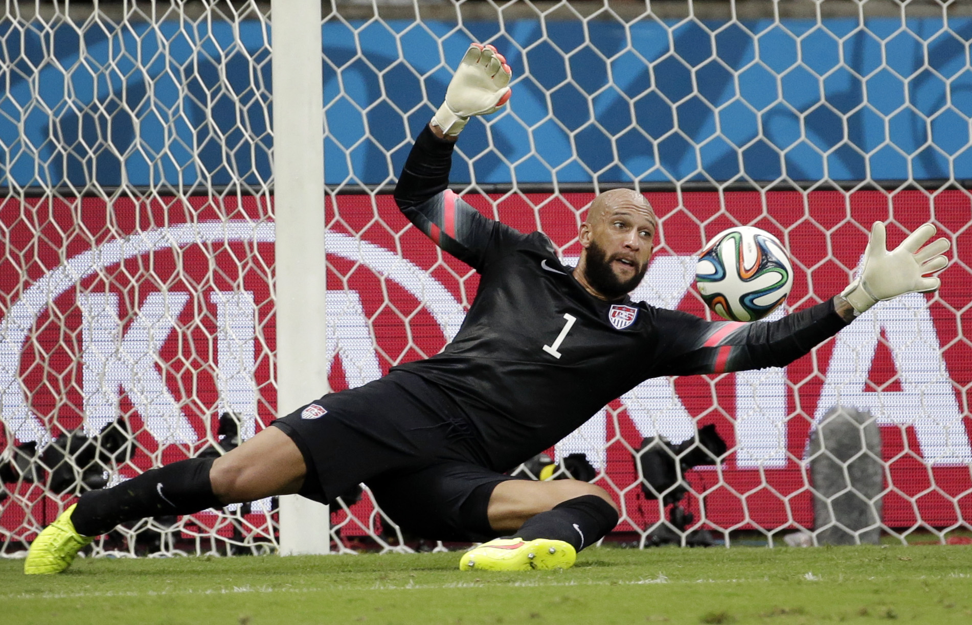 PHOTO: United States' goalkeeper Tim Howard saves a shot by Belgium during the World Cup match between Belgium and the USA at the Arena Fonte Nova in Salvador, Brazil,  July 1, 2014. 