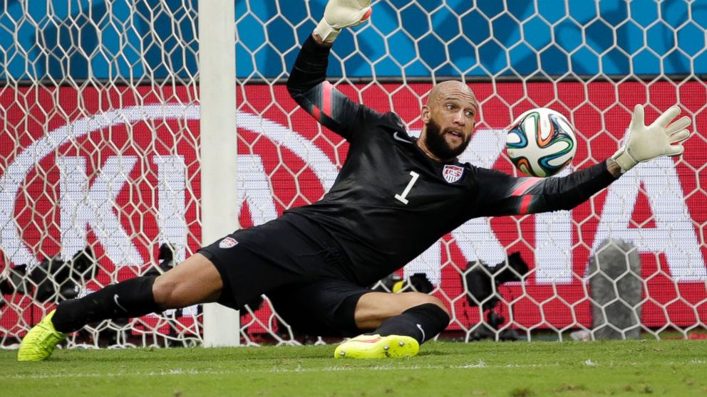 United States' goalkeeper Tim Howard saves a shot by Belgium during the World Cup match between Belgium and the USA at the Arena Fonte Nova in Salvador, Brazil,  July 1, 2014. 
