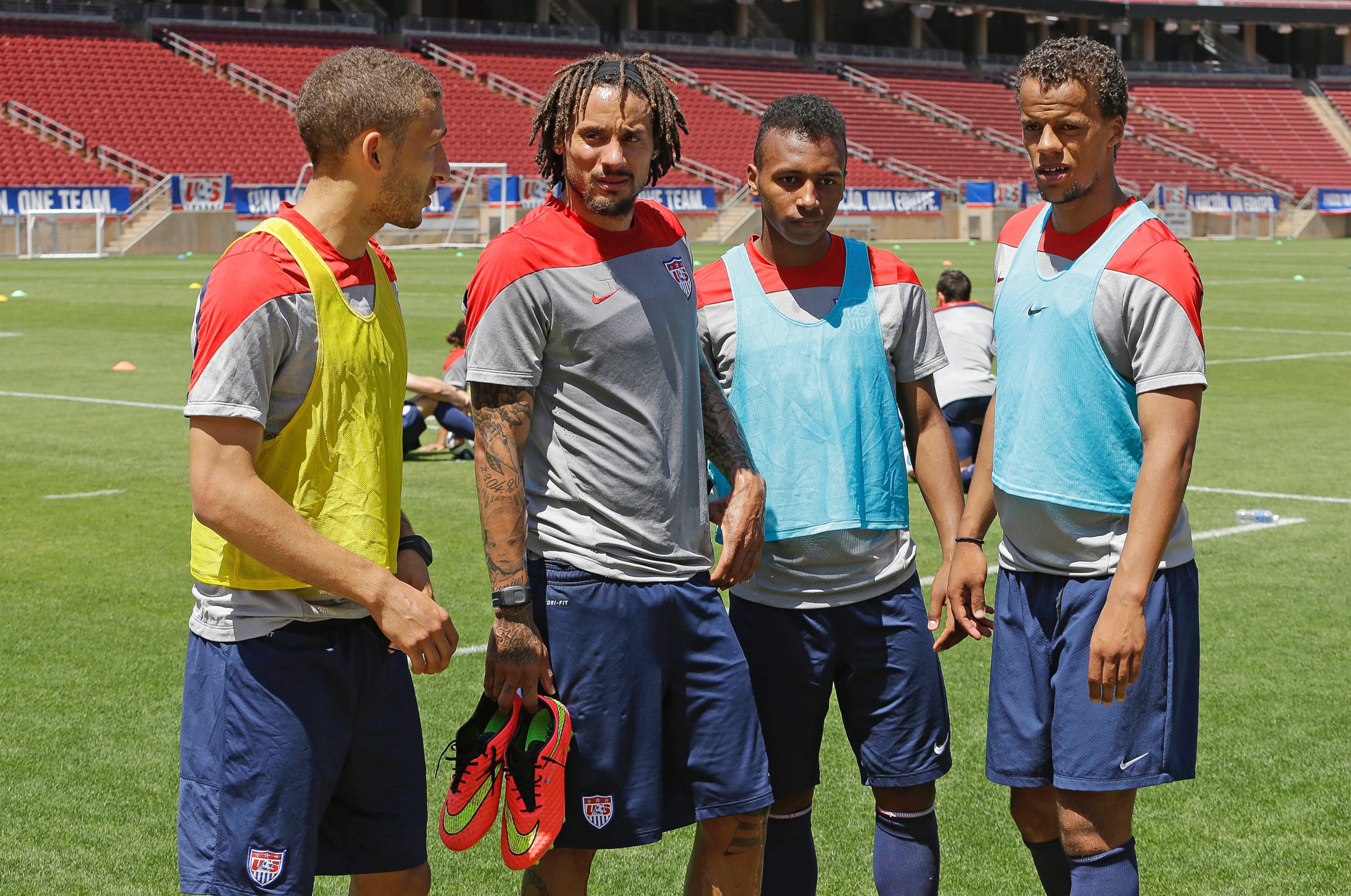 PHOTO: German-American players on the U.S. World Cup team, Fabian Johnson, Jermaine Jones, Julian Green, and Timothy Chandler meet after a practice in Stanford, Calif. on May 22, 2014.