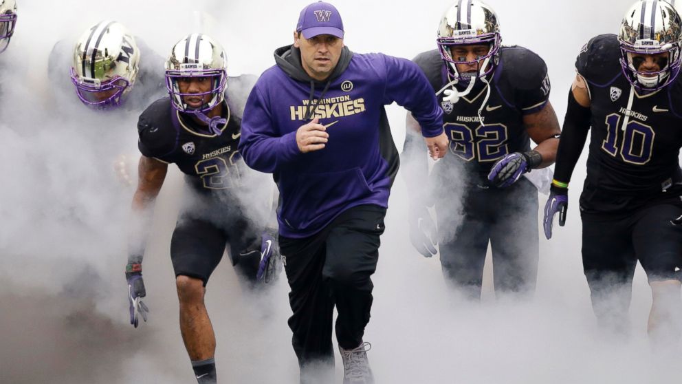 In this Nov. 29, 2013 file photo, Washington head coach Steve Sarkisian runs onto the field before a game against Washington State in Seattle. 