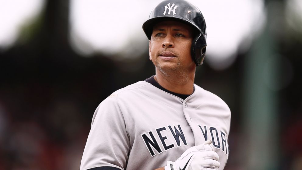 New York Yankees Alex Rodriguez walks through the dugout to the