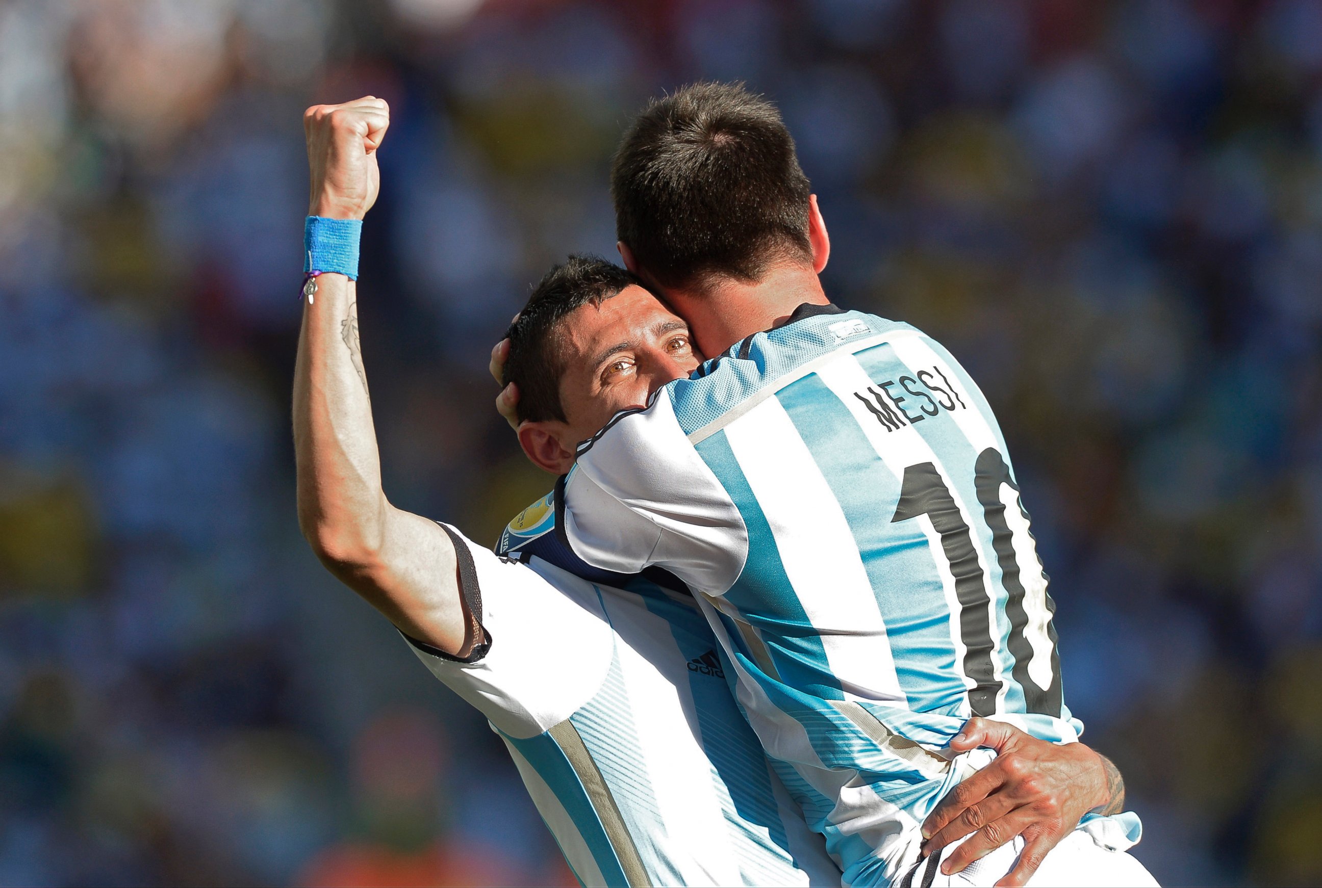 PHOTO: Argentina's Lionel Messi celebrates with Angel di Maria after di Maria scored his side's only and winning goal in extra time during the World Cup match between Argentina and Switzerland at the Itaquerao Stadium in Sao Paulo, Brazil, July 1, 2014.