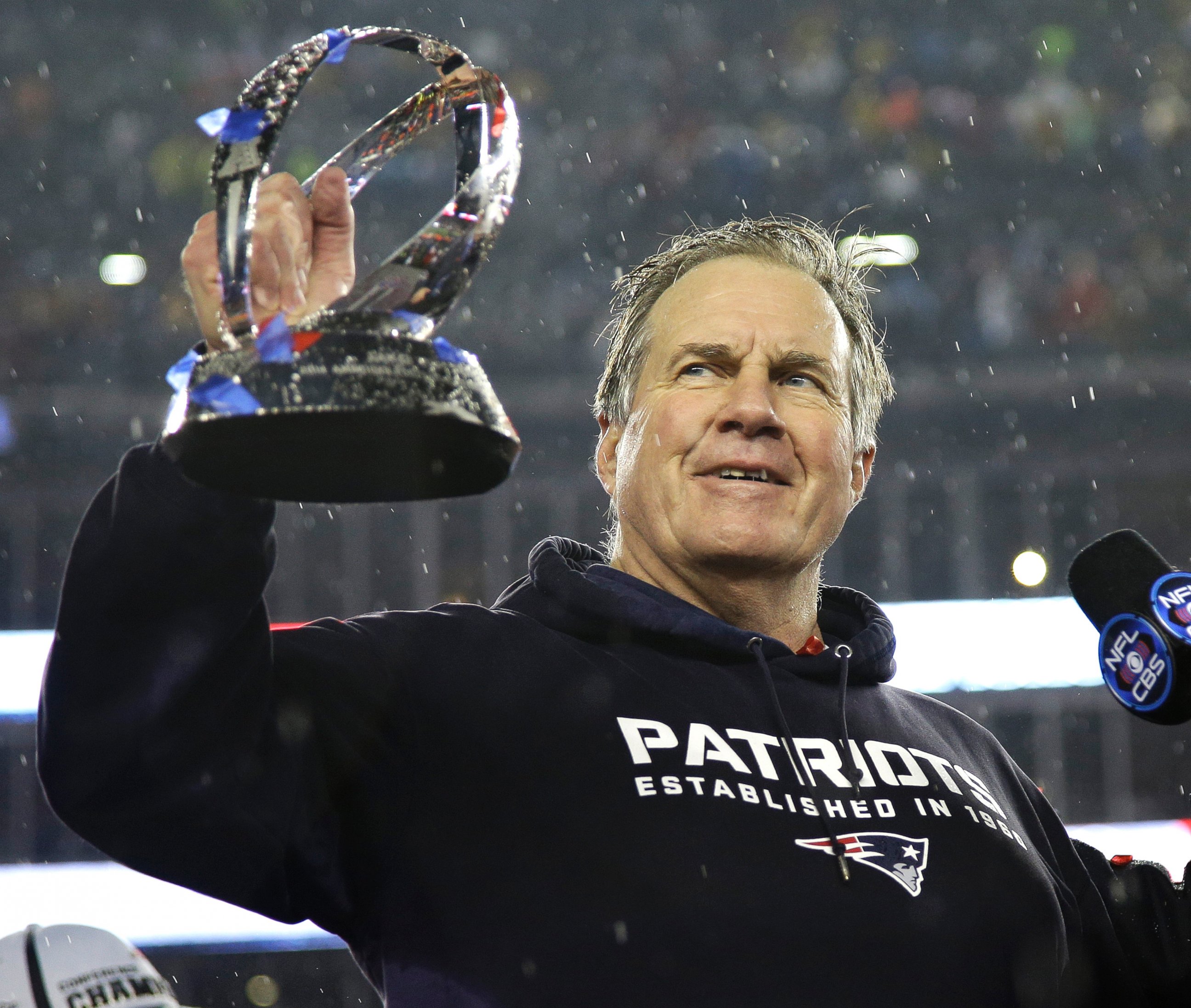 PHOTO: New England Patriots head coach Bill Belichick holds the championship trophy after the NFL football AFC Championship game on Jan. 18, 2015, in Foxborough, Mass.