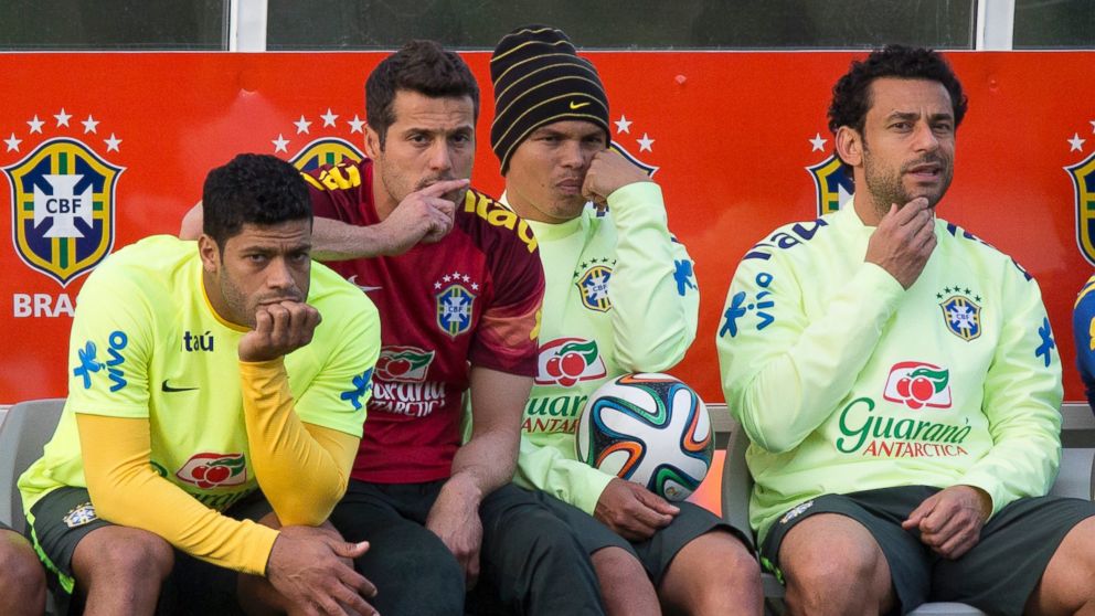 PHOTO: Brazil national soccer team members, from left, Hulk, Julio Cesar, Thiago Silva and Fred, watch other teammates train during a practice session at the Granja Comary training center, in Teresopolis, Brazil,  July 6, 2014. 