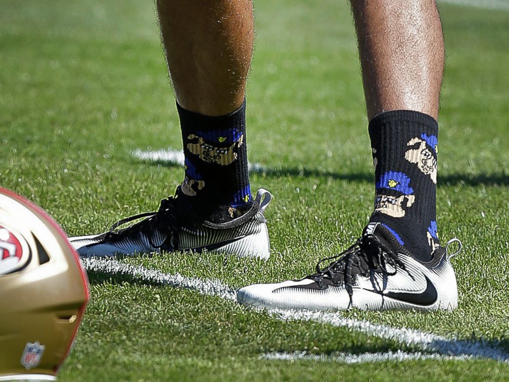 PHOTO: San Francisco 49ers quarterback Colin Kaepernick wears socks depicting police officers as pigs during NFL football training camp at Kezar Stadium in San Francisco, Aug. 10, 2016.