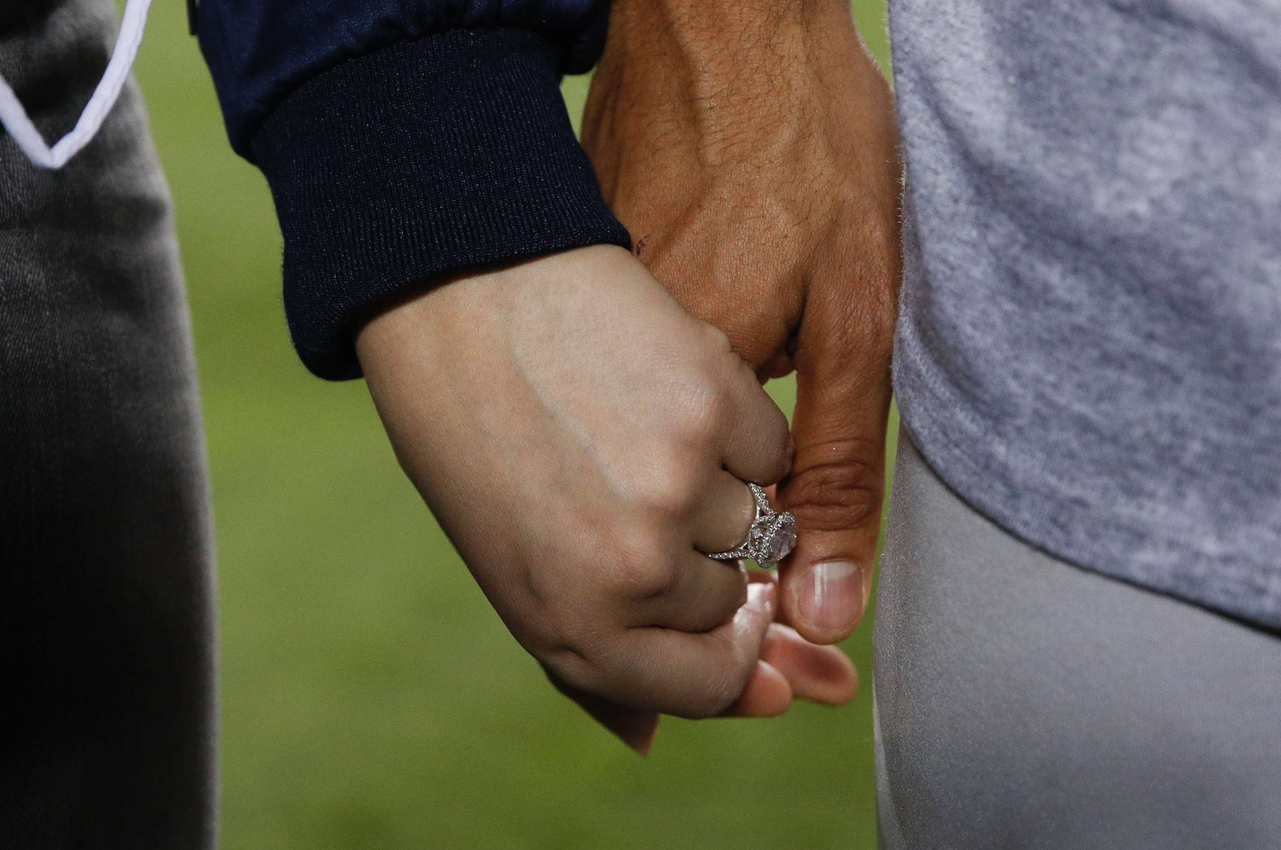 PHOTO: Daniella Rodriguez wearing her engagement ring, holds hands with Houston Astros' Carlos Correa after Game 7 of baseball's World Series Wednesday, Nov. 1, 2017, in Los Angeles. The Astros won 5-1 to win the series 4-3.
