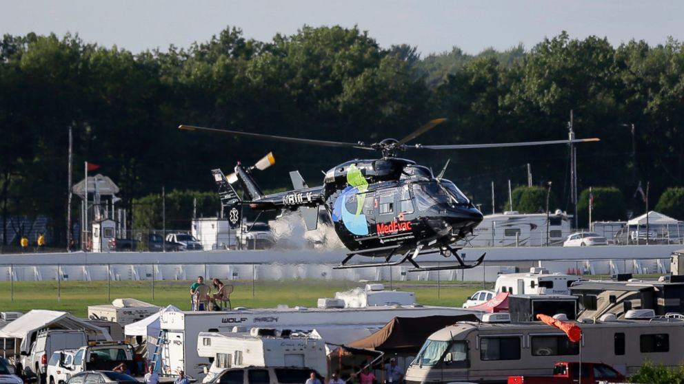 A helicopter lifts off at Pocono Raceway carrying race car driver Justin Wilson, of England, after he was involved in a crash during the Pocono IndyCar 500 auto race Sunday, Aug. 23, 2015, in Long Pond, Pa.