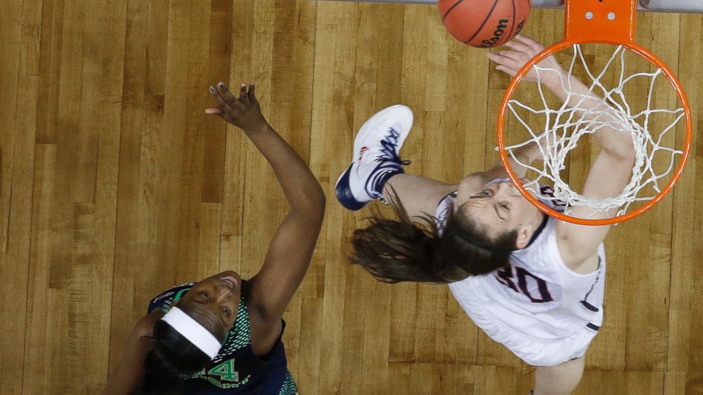 Connecticut forward Breanna Stewart (30) shoots against Notre Dame guard Jewell Loyd (32) during the first half of the championship game in the Final Four of the NCAA women's college basketball tournament, Tuesday, April 8, 2014, in Nashville, Tenn.