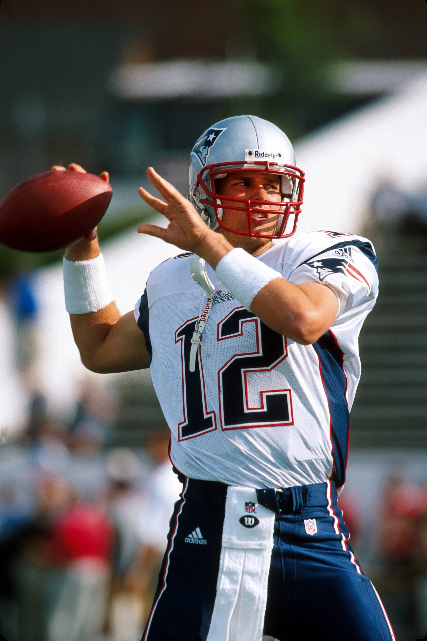 PHOTO: Quarterback Tom Brady (12) of the New England Patriots sets up to pass during pre-game drills before a 20 - 0 victory over the San Francisco 49ers on July 31, 2000, at Fawcett Stadium in Canton, Ohio. 