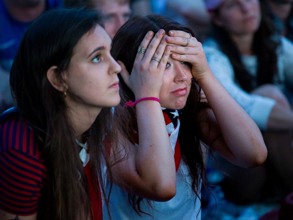PHOTO: Allison DiFilippo, left, and Samantha Donat, both of New York, react to a last-minute goal that put Portugal even with United States at the end of their 2014 World Cup soccer match, while watching on Governor's Island in New York,  June 22, 2014. 