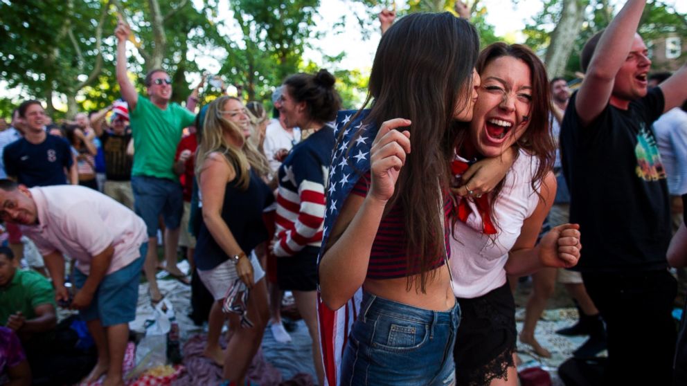 Allison DiFilippo, left, and Samantha Donat, both of New York, react as the United States went up 2-1 over Portugal in the second half as they watched the 2014 World Cup soccer match on Governor's Island in New York, June 22, 2014.
