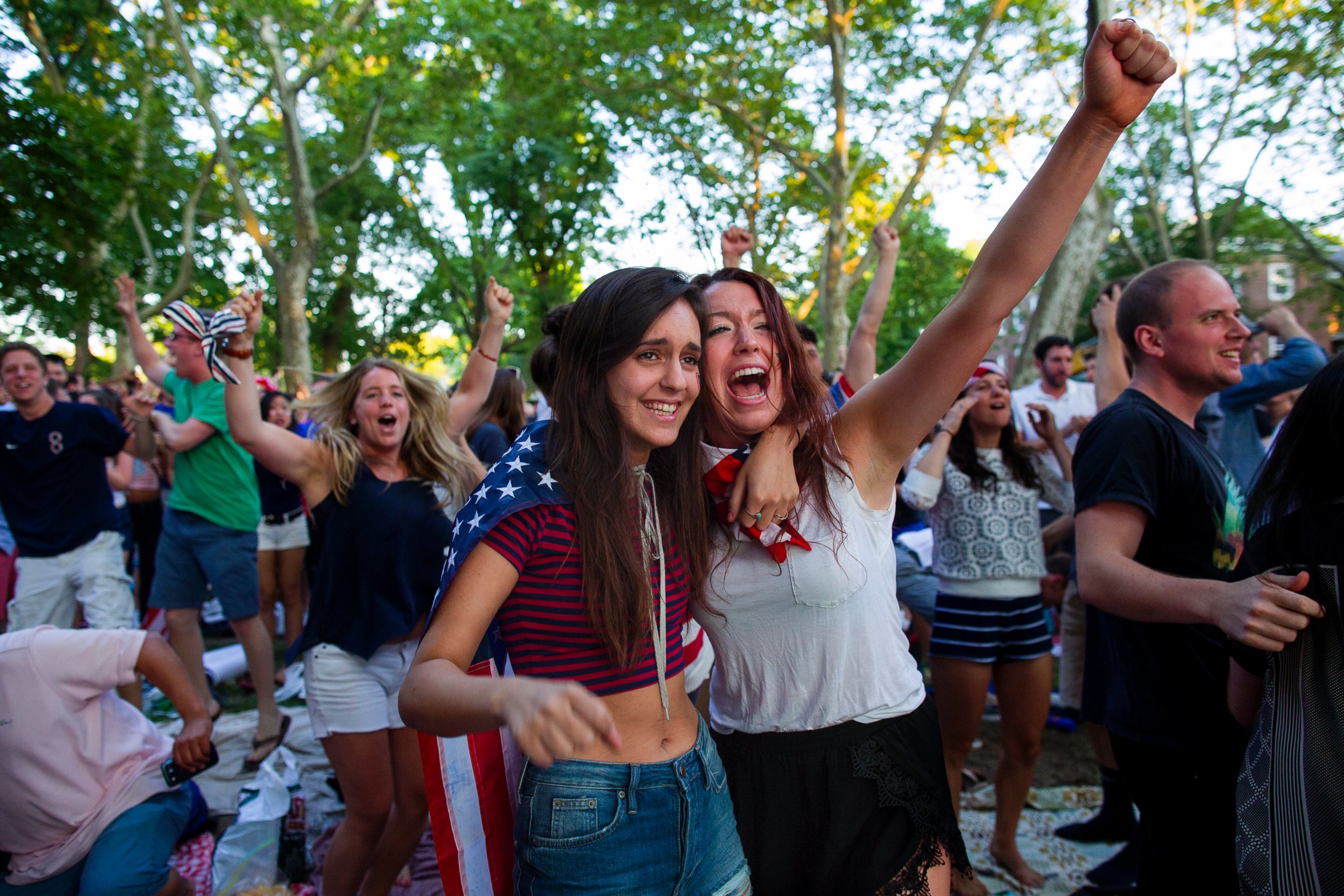 PHOTO: Allison DiFilippo, left, and Samantha Donat, both of New York, react as the United States went up 2-1 over Portugal in the second half as they watched the 2014 World Cup Group G soccer match on Governor's Island in New York, June 22, 2014. 