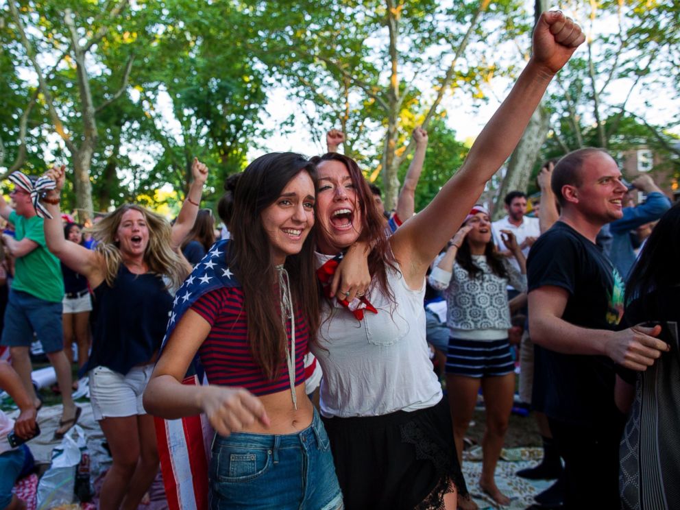 PHOTO: Allison DiFilippo, left, and Samantha Donat, both of New York, react as the United States went up 2-1 over Portugal in the second half as they watched the 2014 World Cup Group G soccer match on Governors Island in New York, June 22, 2014.
