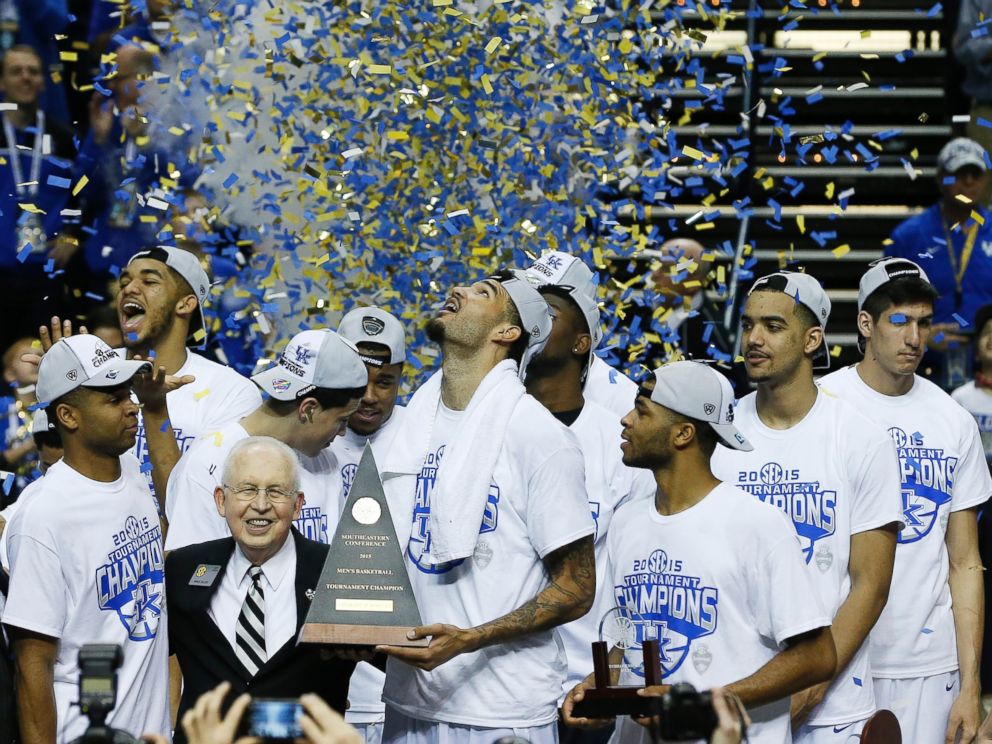 PHOTO: Kentucky forward Willie Cauley-Stein holds the trophy after the NCAA college basketball Southeastern Conference tournament championship game against Arkansas, March 15, 2015, in Nashville, Tenn. 