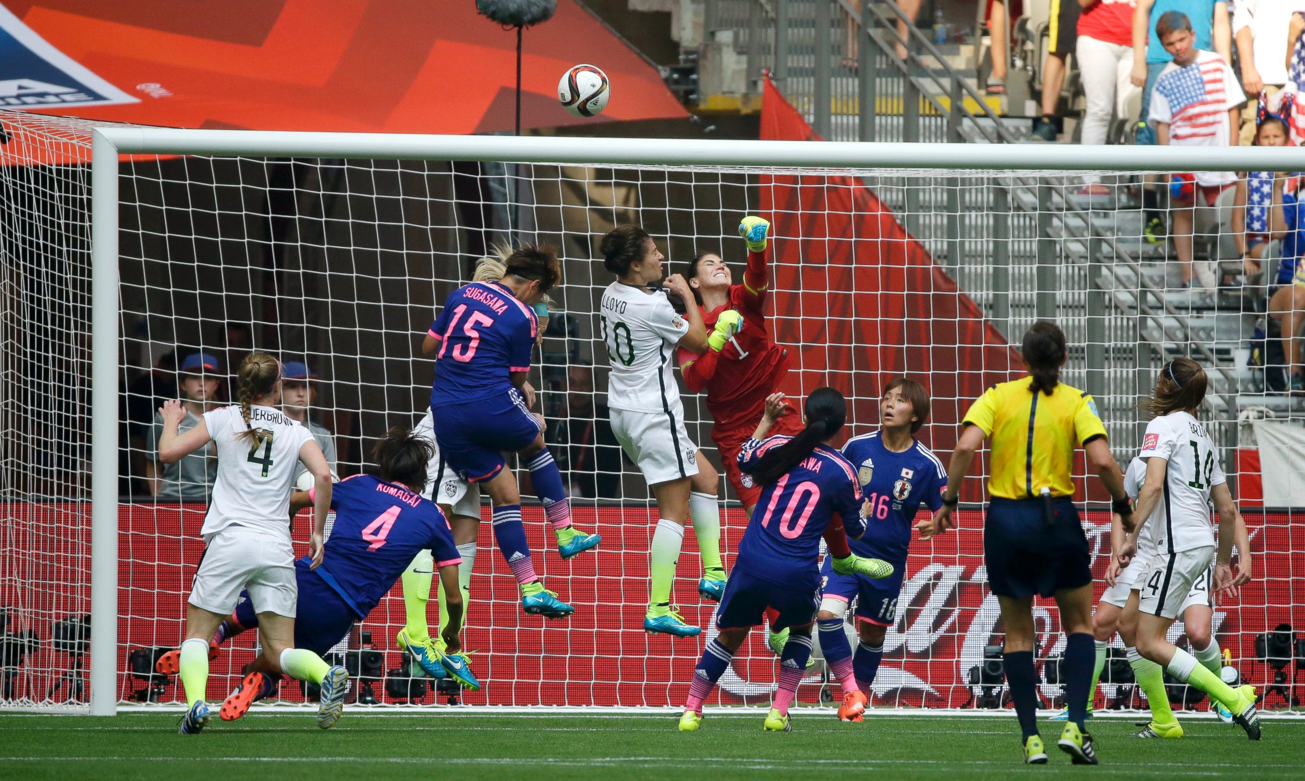 PHOTO: United States goalkeeper Hope Solo (1), center, punches away a shot from Japan during the second half of the FIFA Women's World Cup soccer championship in Vancouver, British Columbia, Canada, Sunday, July 5, 2015.