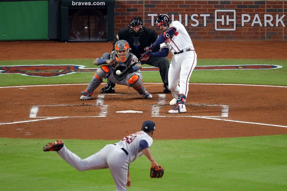 PHOTO: Adam Duvall of the Atlanta Braves hits a grand slam home run against Framber Valdez of the Houston Astros during the first inning in Game Five of the World Series at Truist Park on Oct. 31, 2021, in Atlanta.