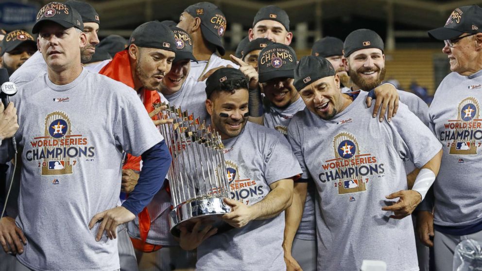 PHOTO: Jose Altuve (C) of the Houston Astros holds the World Series championship trophy after a 5-1 victory over the Los Angeles Dodgers in Game 7 of the World Series, at Dodger Stadium, Nov. 1, 2017, in Los Angeles.