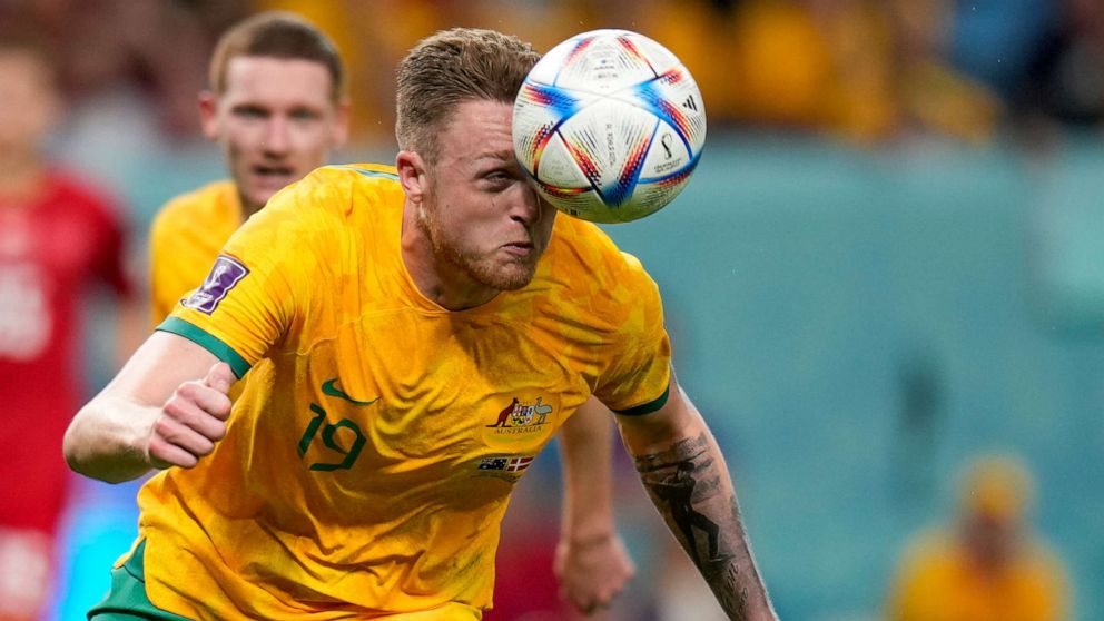PHOTO: Australia's Harry Souttar heads the ball during the World Cup group D soccer match between Australia and Denmark, at the Al Janoub Stadium in Al Wakrah, Qatar, Wednesday, Nov. 30, 2022.