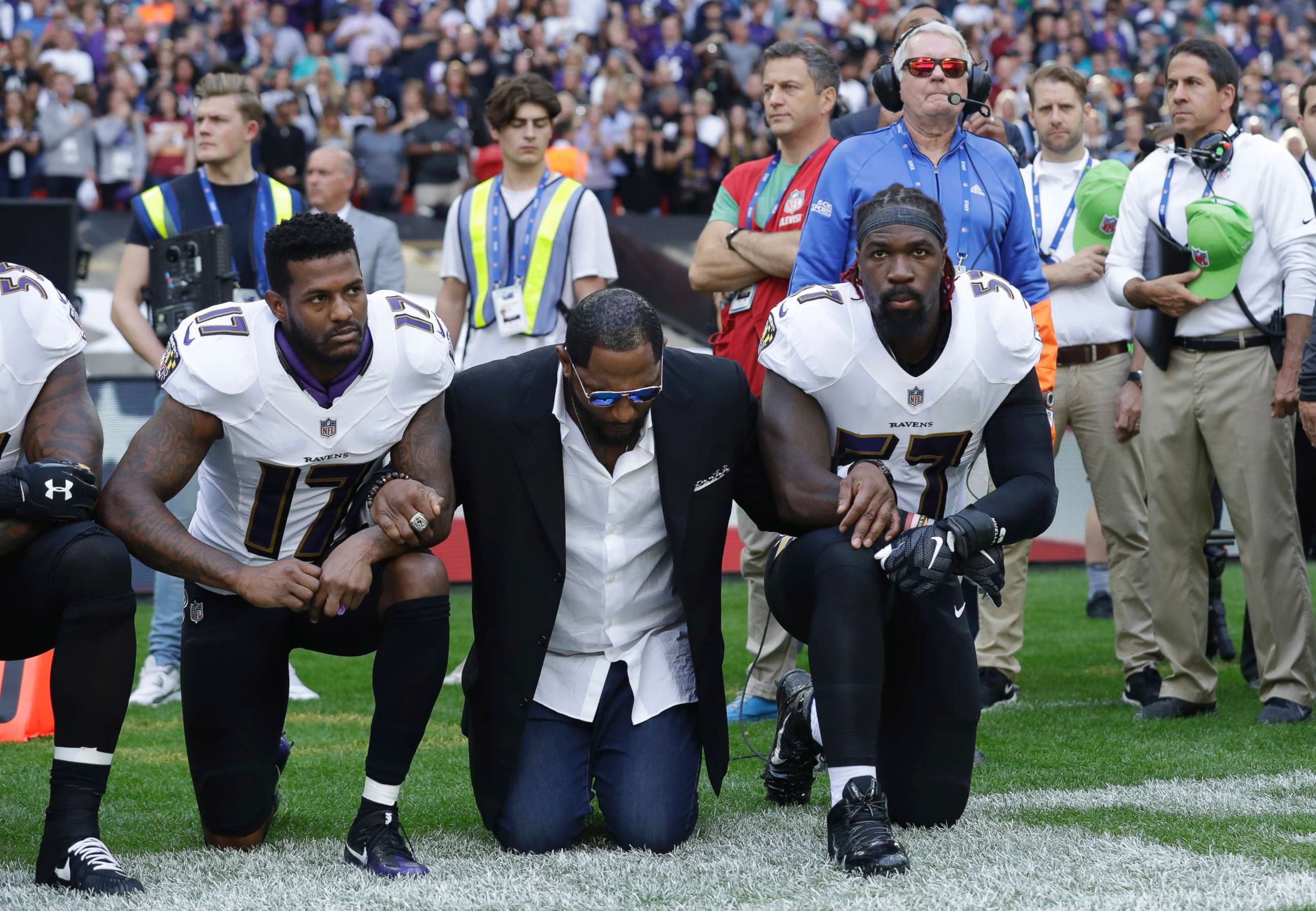 PHOTO: (L-R) Baltimore Ravens wide receiver Mike Wallace, former player Ray Lewis and inside linebacker C.J. Mosley lock arms and kneel down during the playing of the U.S. national anthem in London, Sept. 24, 2017.