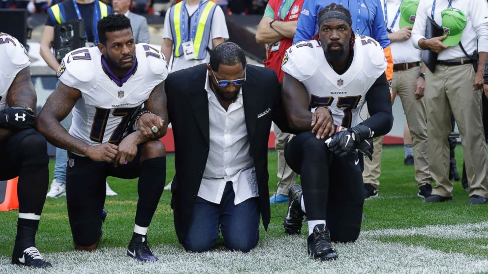 PHOTO: (L-R) Baltimore Ravens wide receiver Mike Wallace, former player Ray Lewis and inside linebacker C.J. Mosley lock arms and kneel down during the playing of the U.S. national anthem in London, Sept. 24, 2017.