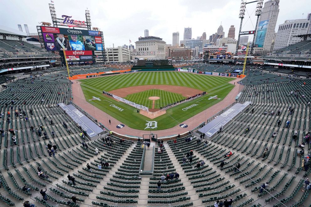 PHOTO: Baseball fans watch the opening ceremony of the Detroit Tigers and Cleveland Indians baseball game at Comerica Park in Detroit, April 1, 2021.