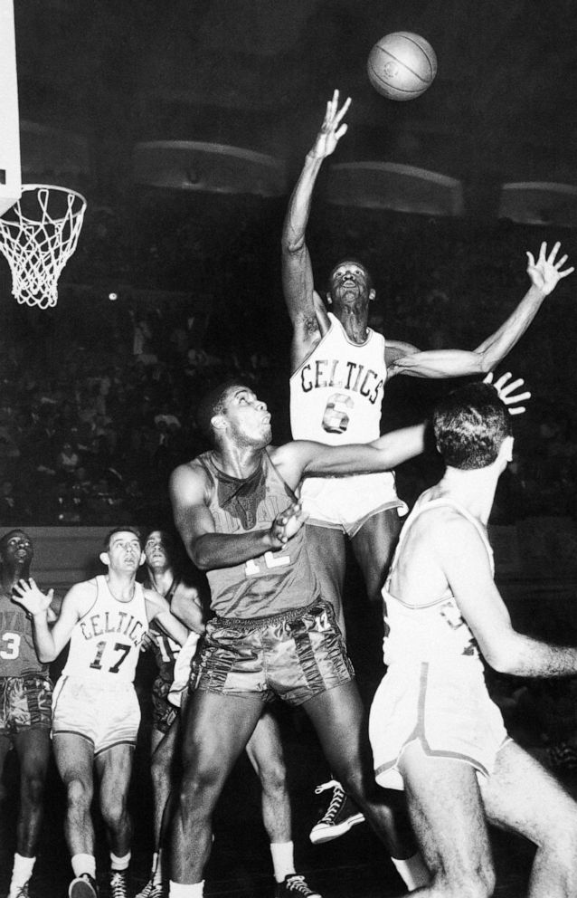 PHOTO: In this Dec. 27, 1956, file photo, Boston Celtics' Bill Russell (6) reaches for a rebound in an NBA basketball game against the Rochester Royals in Philadelphia.