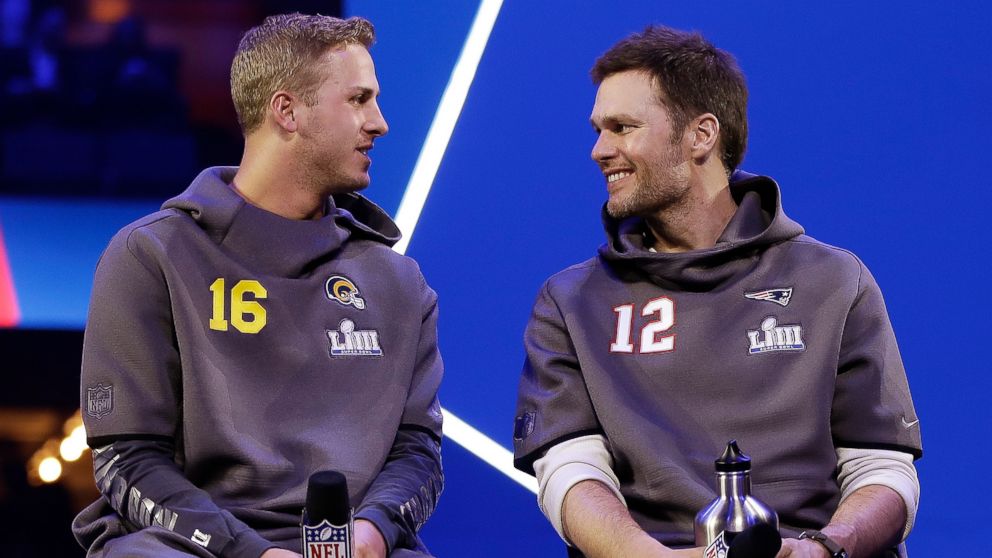 PHOTO: In this Monday, Jan. 28, 2019, file photo, Los Angeles Rams' Jared Goff talks to New England Patriots' Tom Brady during Opening Night for the NFL Super Bowl 53 football game in Atlanta. 