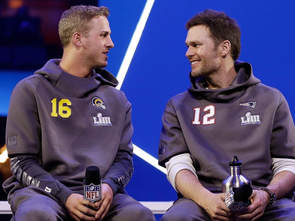 PHOTO:  In this Monday, Jan. 28, 2019, file photo, Los Angeles Rams' Jared Goff talks to New England Patriots' Tom Brady during Opening Night for the NFL Super Bowl 53 football game in Atlanta. 