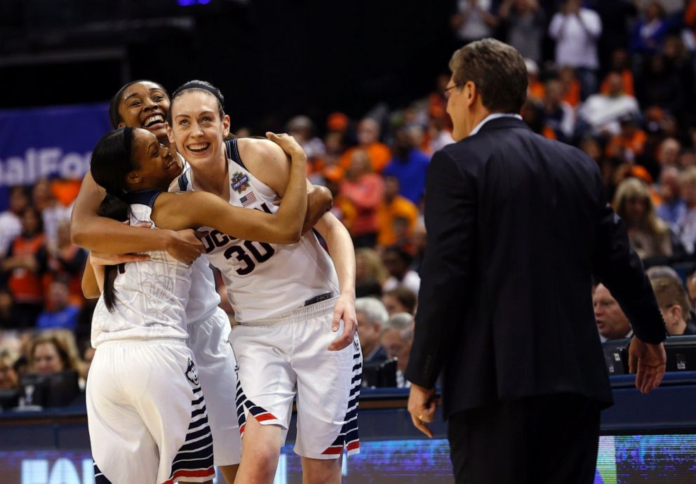 PHOTO: Connecticut's Morgan Tuck, left rear, Moriah Jefferson, left and Breanna Stewart, right, hug as Connecticut head coach Geno Auriemma watches following the championship game in the Final Four on Tuesday, April 5, 2016, in Indianapolis.