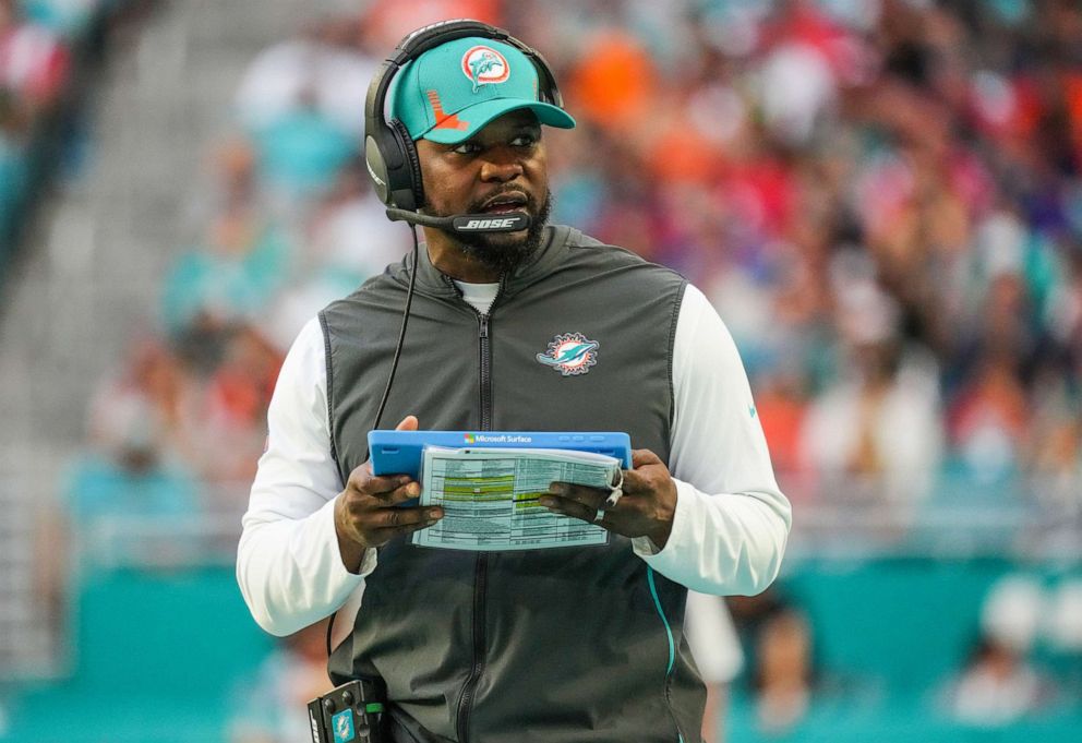 PHOTO: In this Jan. 9, 2022, file photo, head coach Brian Flores of the Miami Dolphins is shown in action against the New England Patriots during the first half, at Hard Rock Stadium in Miami Gardens, Fla.