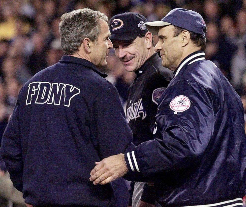 PHOTO: President George W. Bush greets Arizona Diamondback manager Bob Brenley and New York Yankee manager Joe Torre after throwing out the ceremonial "first pitch," Oct. 30, 2001, at Yankee Stadium in New York City.