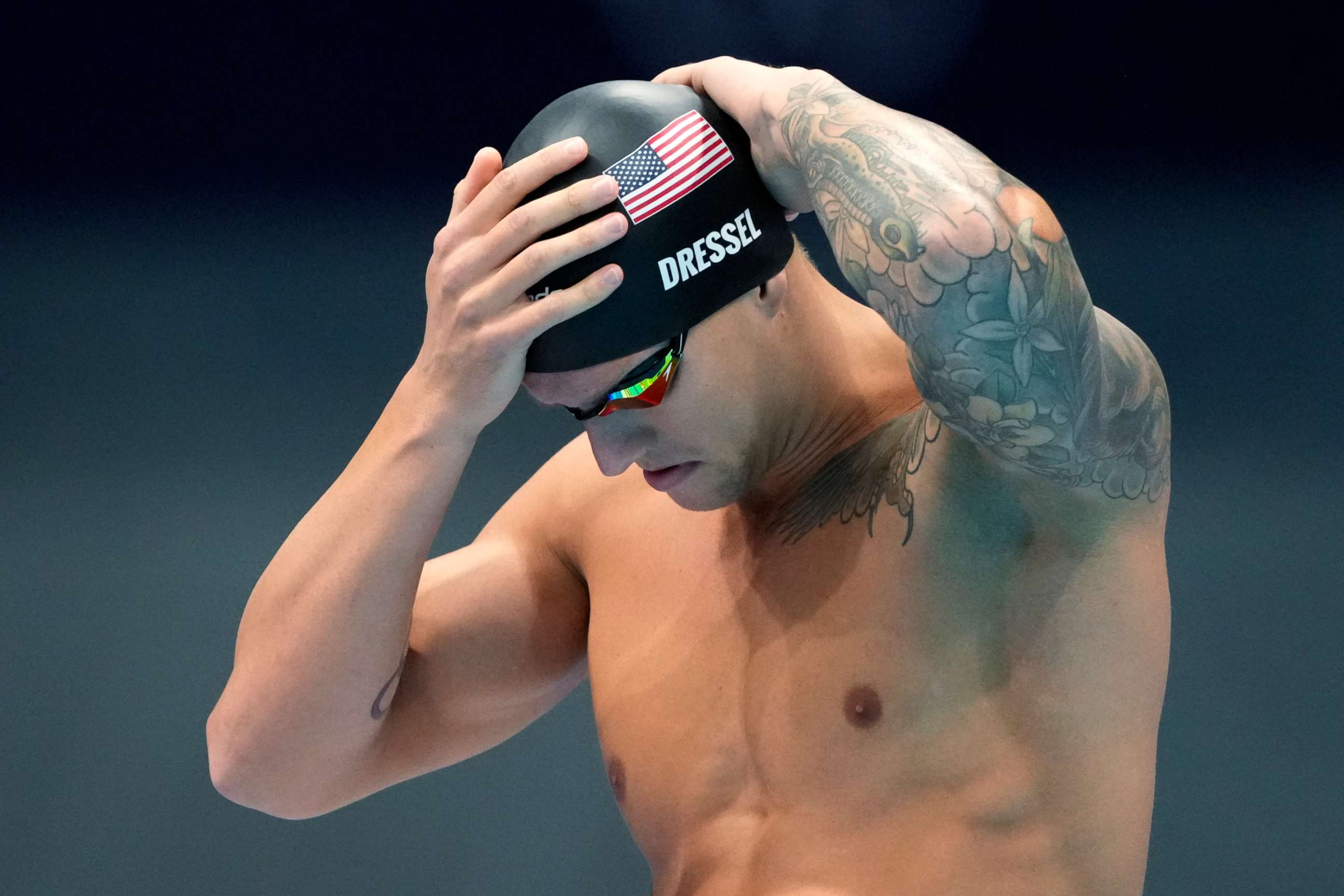PHOTO: Caeleb Dressel of the United States prepares for his men's 100-meter freestyle semifinal at the 2020 Summer Olympics, Wednesday, July 28, 2021, in Tokyo. 