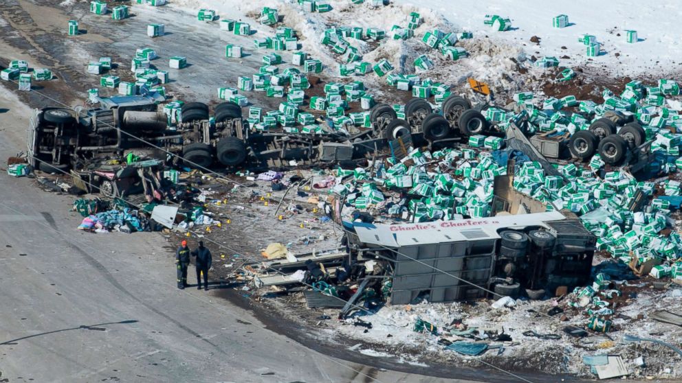 Emergency personnel work at the scene of a fatal crash outside of Tisdale, Saskatchewan, Canada, April, 7, 2018.