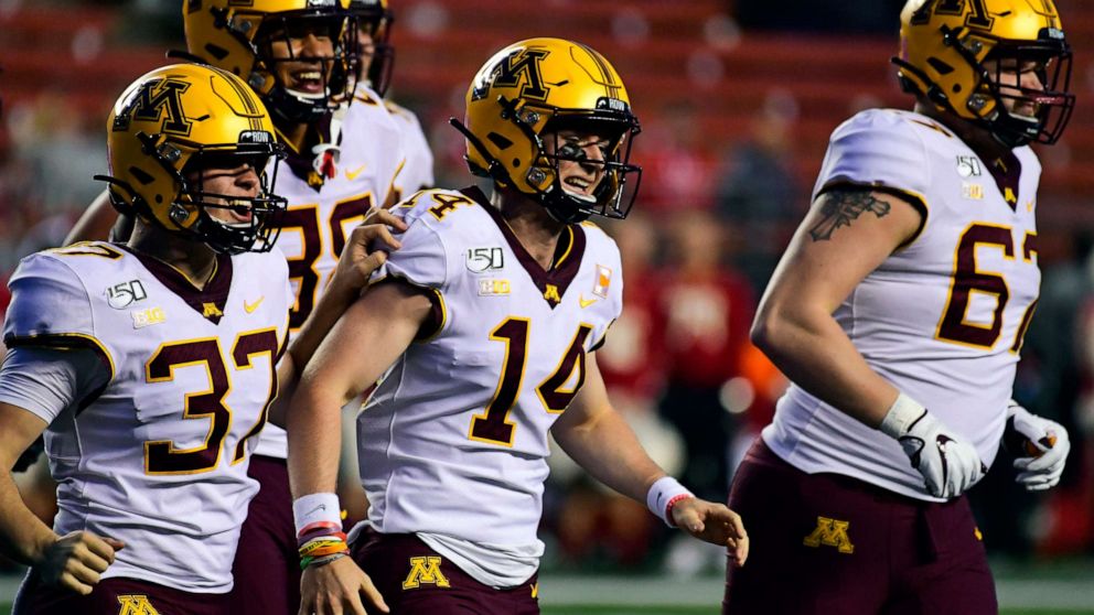 PHOTO: Casey O'Brien, #14, of the Minnesota Golden Gophers, a four-time cancer survivor, is lauded for his efforts as holder during the fourth quarter at SHI Stadium on Oct. 19, 2019, in Piscataway, N.J.
