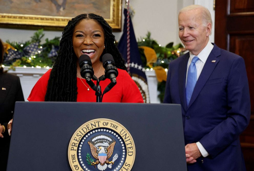 PHOTO: Cherelle Griner talks about the release by Russia of her wife, WNBA basketball star Brittney Griner, as President Joe Biden listens, in the Roosevelt Room at the White House in Washington, Dec. 8, 2022.
