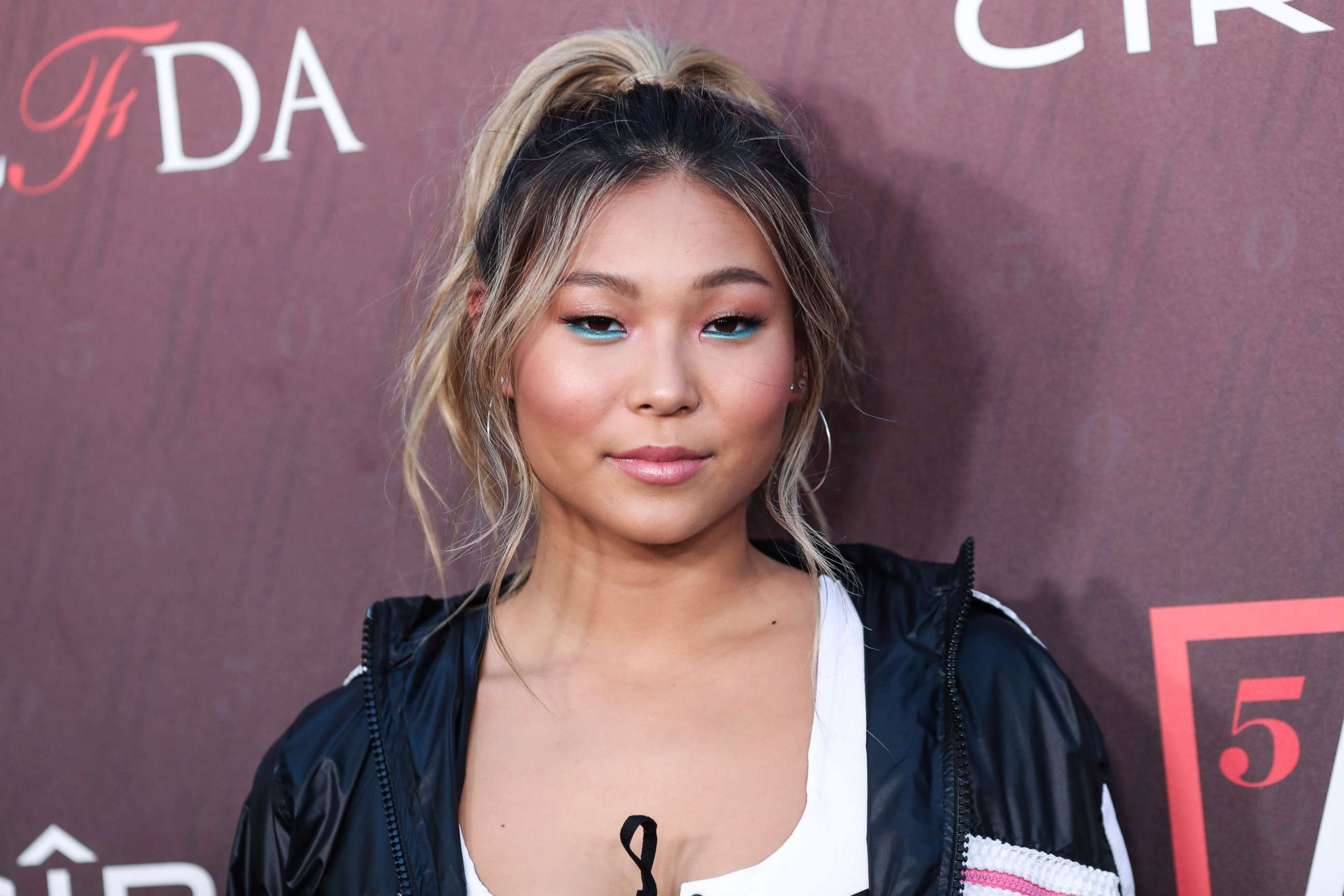 PHOTO: Chloe Kim arrives at the Sports Illustrated Fashionable 50 held at Sunset Room Hollywood, July 18, 2019, in Hollywood, Calif.